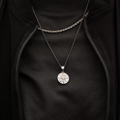 Our Silver Compass Pendant Necklace features our Signature Compass Pendant and Cuban Link Chain. The Perfect piece for any wardrobe.