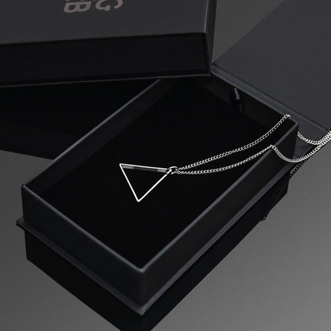 Silver Triangle Necklace - Our Silver Triangle Necklace features our Signature Triangle Pendant and Cuban Link Chain. The Perfect piece for any wardrobe.
