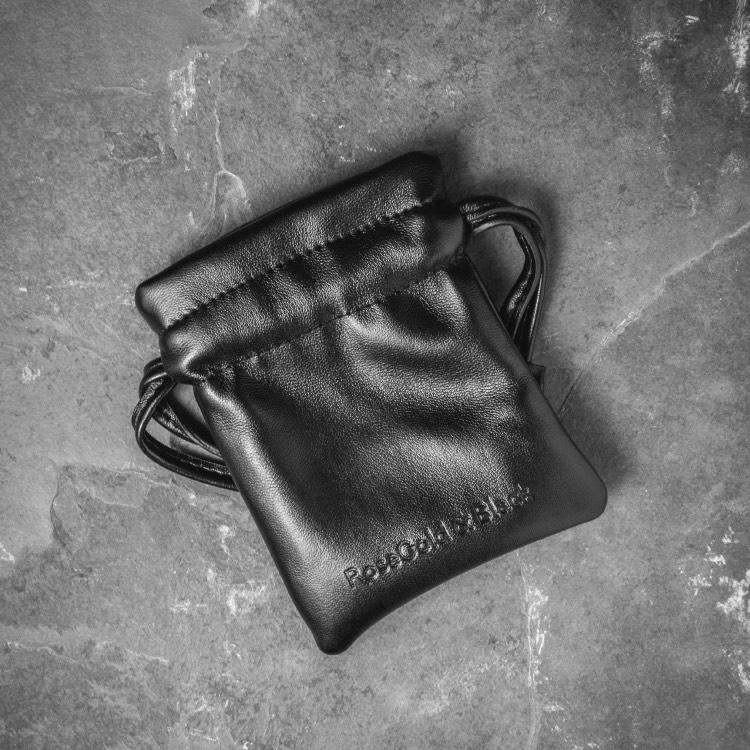 Leather pouch for our Matte Black Bead Bracelet Features Natural Stones, Waxed Cord and Brushed Black Steel Hardware. A Beautiful Addition to any Collection.