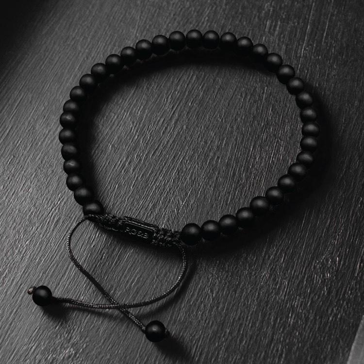 Our Matte Agate Bead Bracelet Features Natural Stones, Waxed Cord and Brushed Black Steel Hardware. A Beautiful Addition to any Collection.