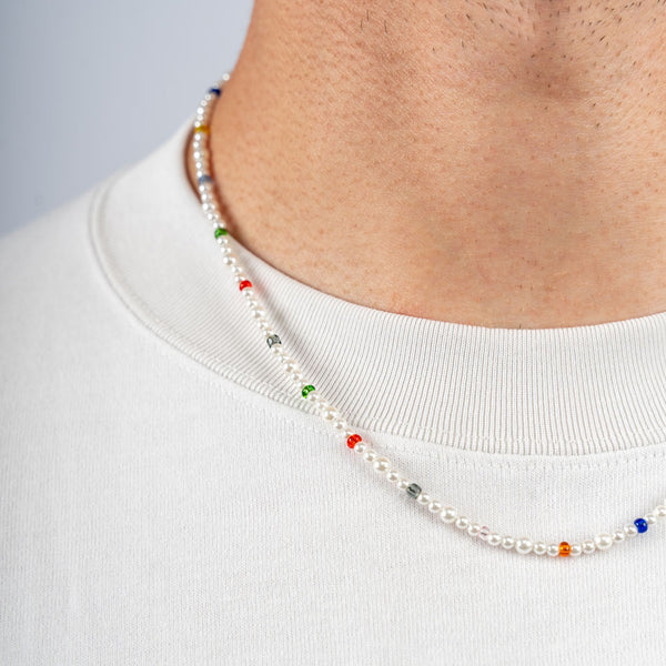 Our Multicolored Asymmetric Pearl Necklace has been crafted using different sized polished white pearls, colored beads and the finest silver hardware to hold it all together.