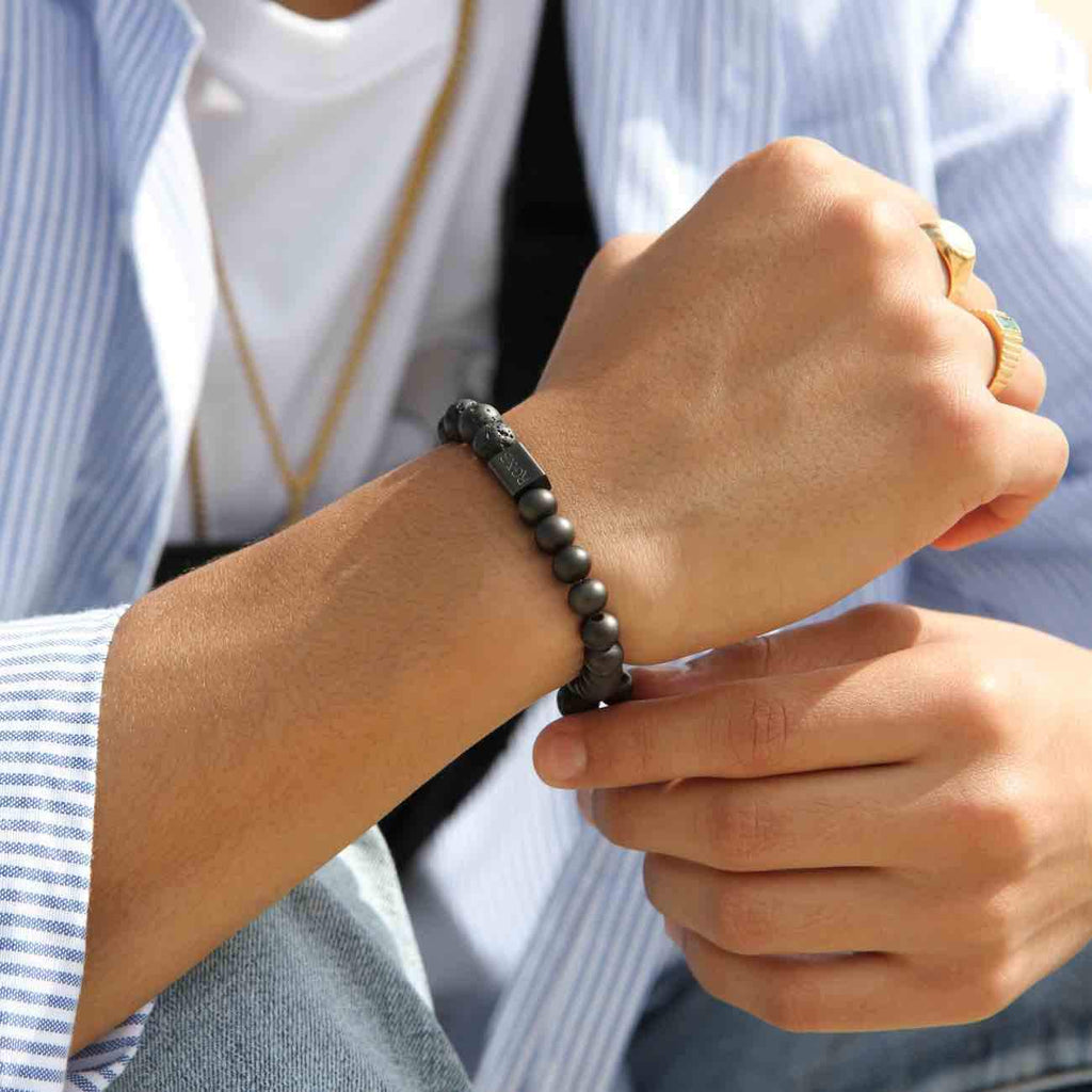 Lava Stone Bead Bracelet - Our Lava Stone Bead Bracelet Features 8mm Natural Stones, Premium Elastic Cord and Brushed Black Hardware. A Beautiful Addition to any Collection.