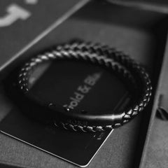 Black Double Leather Bracelet - Our Men's Double Leather Bracelet with Black Leather and a Matte Black Adjustable Clasp Engraved with our Signature RG&B Logo.