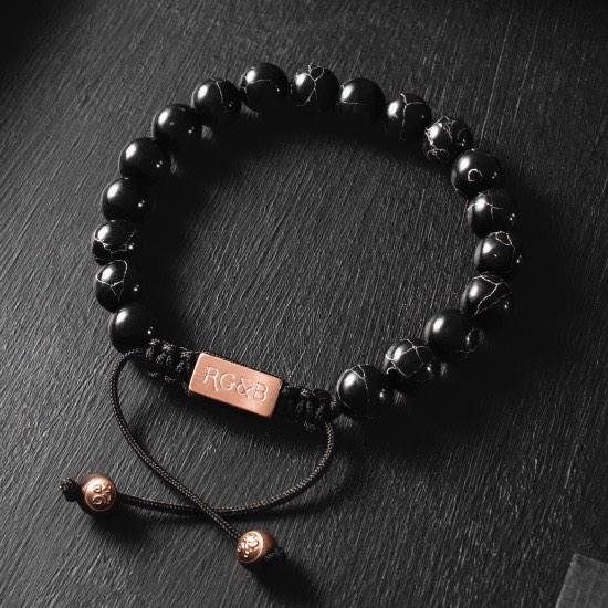 Black Stone Bead Bracelet - Our Black Stone Bead Bracelet Features Natural Stones, Waxed Cord and Brushed Rose Gold Steel Hardware. A Beautiful Addition to any Collection.