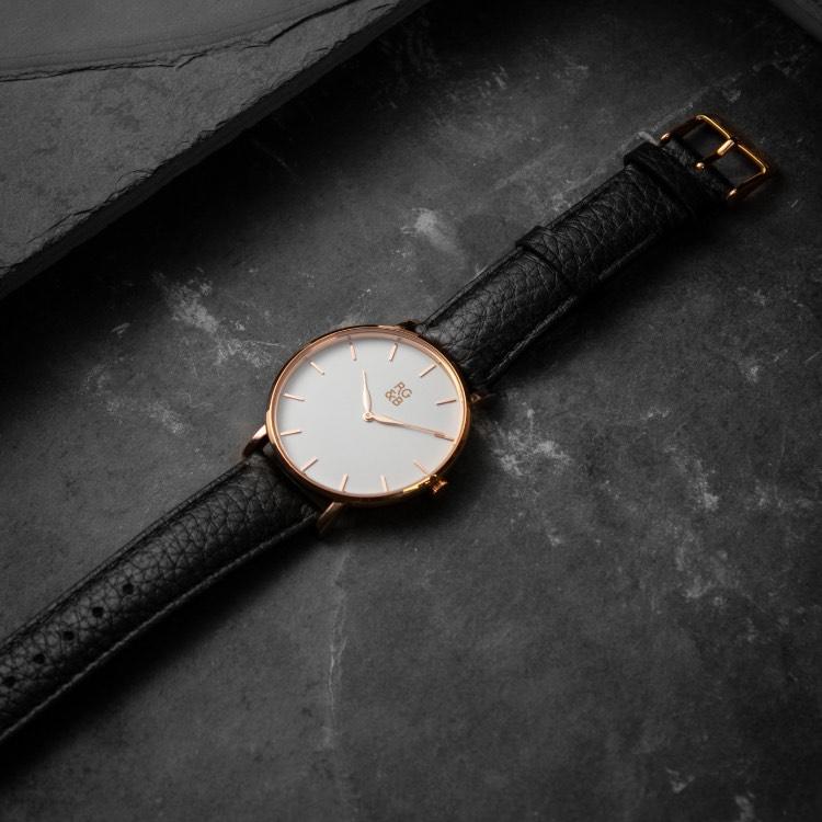 Rose Gold Minimal Watch - Explore our Classic Minimal Watch in Rose Gold & Black. Featuring a Polished Rose Gold Case, Hands & Hour Markers, a White Dial and a Black Leather Strap.