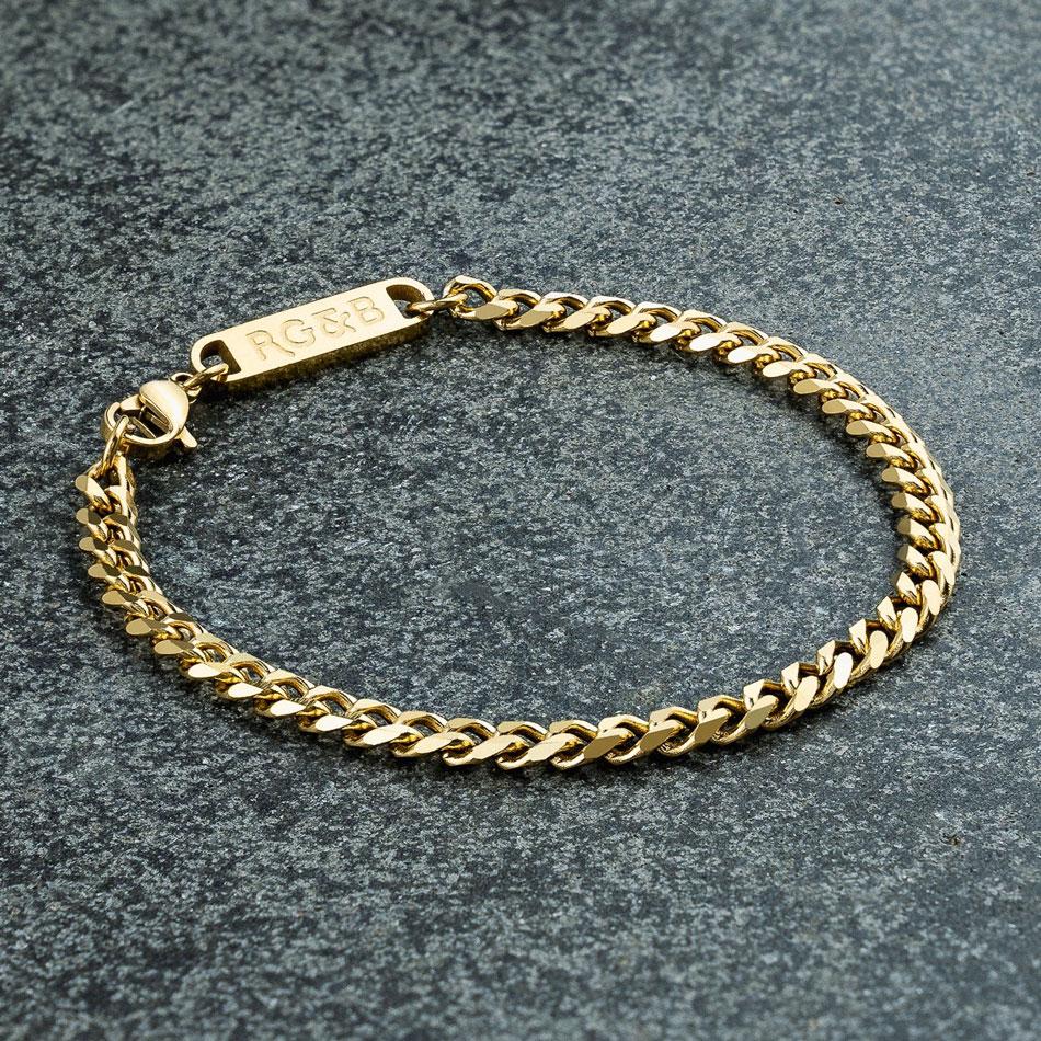 Our Gold Cuban Chain Bracelet features our premium gold cuban chain and signature polished gold plate, engraved with RG&B.