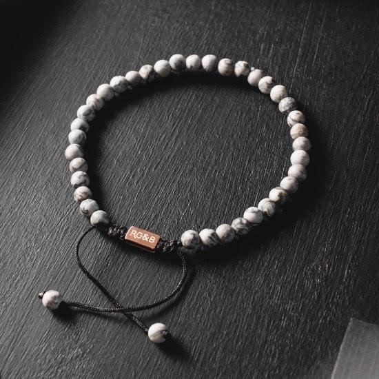 Minimal Grey Jasper Bead Bracelet - Our Minimal Grey Jasper Bead Bracelet Features Natural Stones, Waxed Cord and Brushed Rose Gold Steel Hardware. A Beautiful Addition to any Collection.