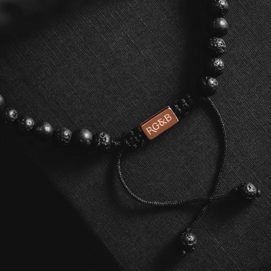 Minimal Lava Stone Bead Bracelet - Our Minimal Lava Stone Bead Bracelet Features Natural Stones, Waxed Cord and Brushed Rose Gold Steel Hardware. A Beautiful Addition to any Collection.