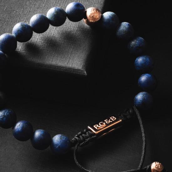 Premium Lapis Lazuli Bracelet - Our Premium Lapis Lazuli Bead Bracelet Features Natural Stones, Waxed Cord and Polished Rose Gold Steel Hardware. A Beautiful Addition to any Collection.