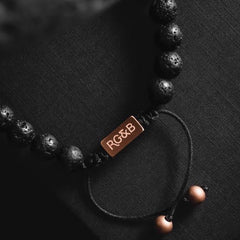 Lava Stone Bead Bracelet - Our Lava Stone Bead Bracelet Features Natural Stones, Waxed Cord and Brushed Rose Gold Steel Hardware, Engraved with the Signature RG&B Logo.