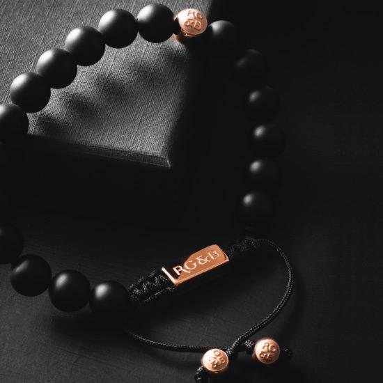 Premium Matte Black Bracelet - Our Premium Matte Black Bead Bracelet Features Natural Stones, Waxed Cord and Polished Rose Gold Steel Hardware. A Beautiful Addition to any Collection.