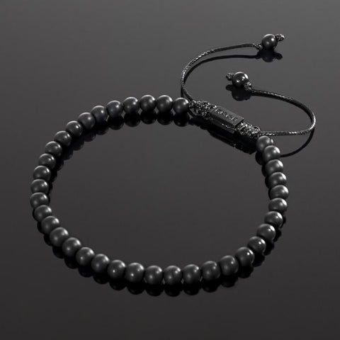 Our Matte Agate Bead Bracelet Features Natural Stones, Waxed Cord and Brushed Black Steel Hardware. A Beautiful Addition to any Collection.