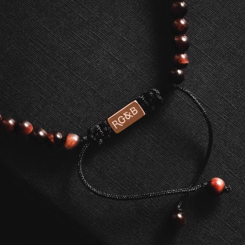 Minimal Red Tiger Eye Bead Bracelet - Our Minimal Red Tiger Eye Bead Bracelet Features Natural Stones, Waxed Cord and Brushed Rose Gold Steel Hardware. A Beautiful Addition to any Collection.
