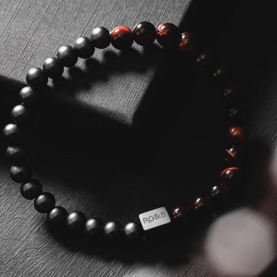 Red Tiger Eye Bead Bracelet - Our Red Tiger Eye Bead Bracelet Features 6mm Natural Stones, Premium Elastic Cord and Brushed Black Hardware. A Beautiful Addition to any Collection.
