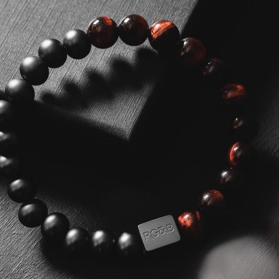 Red Tiger Eye Bead Bracelet - Our Red Tiger Eye Bead Bracelet Features 8mm Natural Stones, Premium Elastic Cord and Brushed Black Hardware. A Beautiful Addition to any Collection.