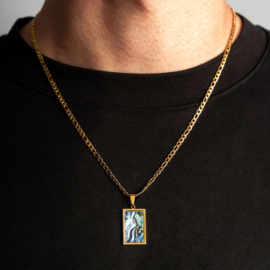 Our Premium Rectangle Pendant paired with our Signature Figaro Chain is the perfect touch of Gold & Opal.