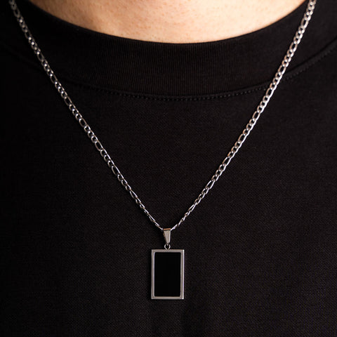 Our Premium Rectangle Pendant paired with our Signature Figaro Chain is the perfect touch of Silver & Black.