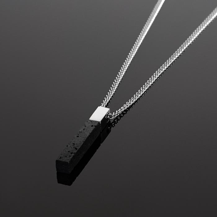Our Silver & Lava Stone Bar Necklace has been crafted with minimalist styling in mind featuring a Lava Stone Bar Pendant and Cuban chain.