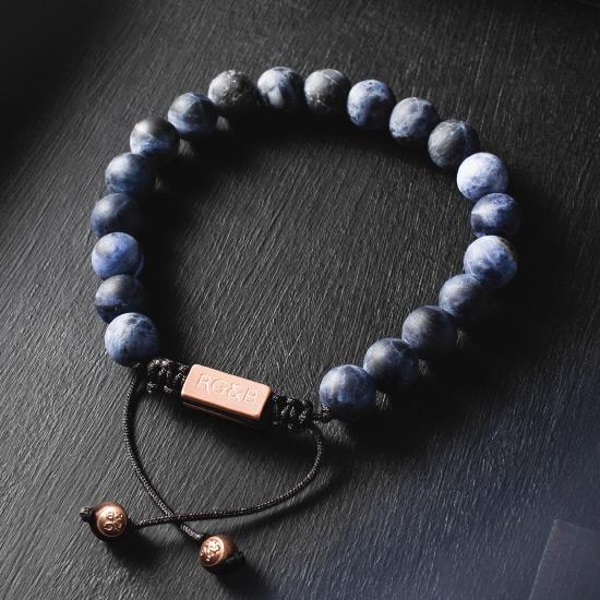 Sodalite Bracelet - Our Sodalite Bead Bracelet Features Natural Stones, Waxed Cord and Brushed Rose Gold Steel Hardware. A Beautiful Addition to any Collection.