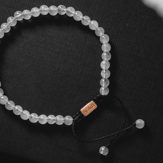 Minimal White Jade Bead Bracelet - Our Minimal White Jade Bead Bracelet Features Natural Stones, Waxed Cord and Brushed Rose Gold Steel Hardware. A Beautiful Addition to any Collection.